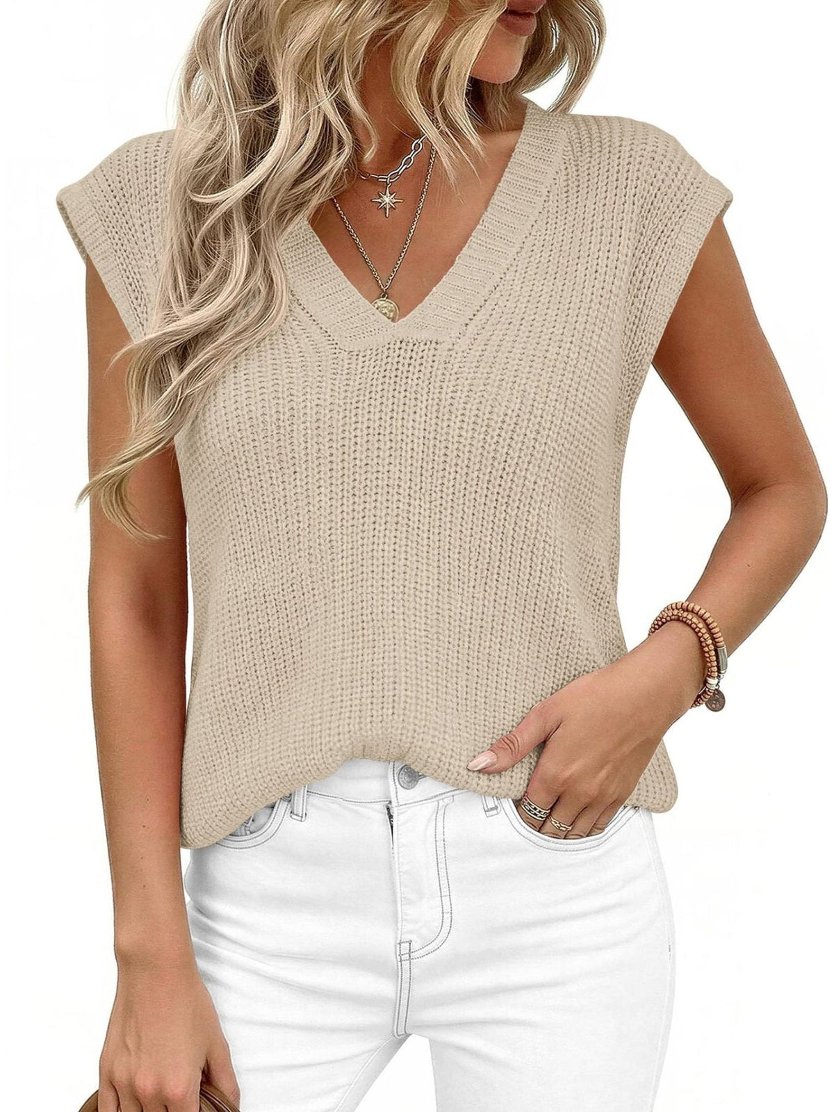 Textured apricot V-neck sweater vest with cap sleeves.
