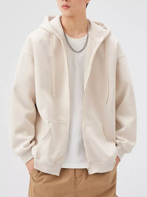Casual loose fit zip-up hoodie in Apricot with drawstring hood and front pockets.