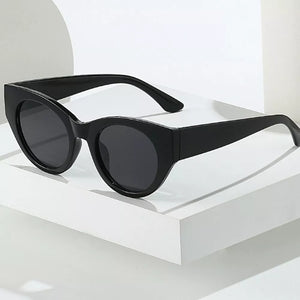 black sunglasses featuring UV400 protection and leopard-print