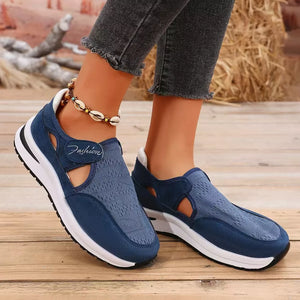 Blue breathable cutout slip-on sneakers with white soles and "Fashion" detail.