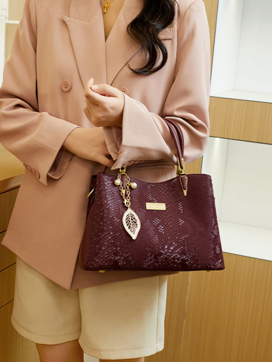 PU Leather Imported Size &amp handbag in burgundy with structured silhouette