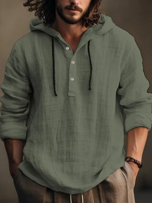 Moss green linen henley hooded pullover with button placket and drawstring.