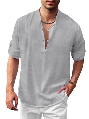 Gray half-button shirt with mandarin collar and rolled sleeves.