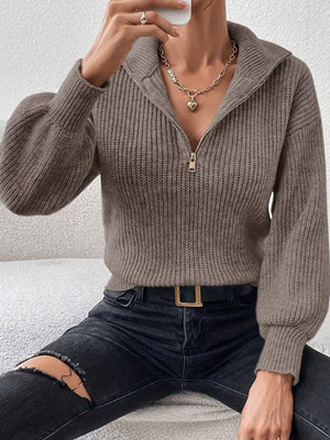 100% polyester Care instructions: Machine wash cold zip-up sweater in Gray with relaxed silhouette