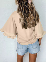 Apricot ruffled mock neck half sleeve shirt with bell sleeves.