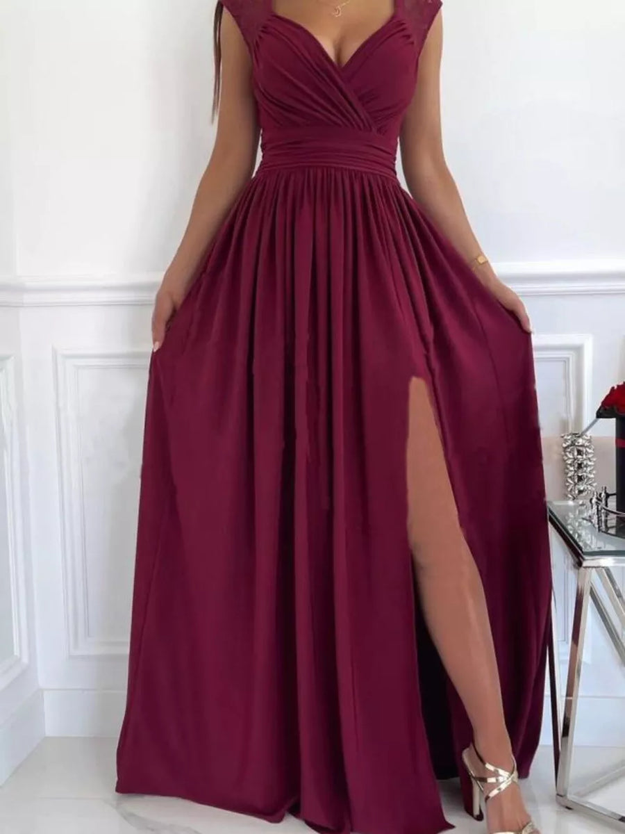 Burgundy maxi dress with lace accents, V-neck, high slit, and ruched waist.
