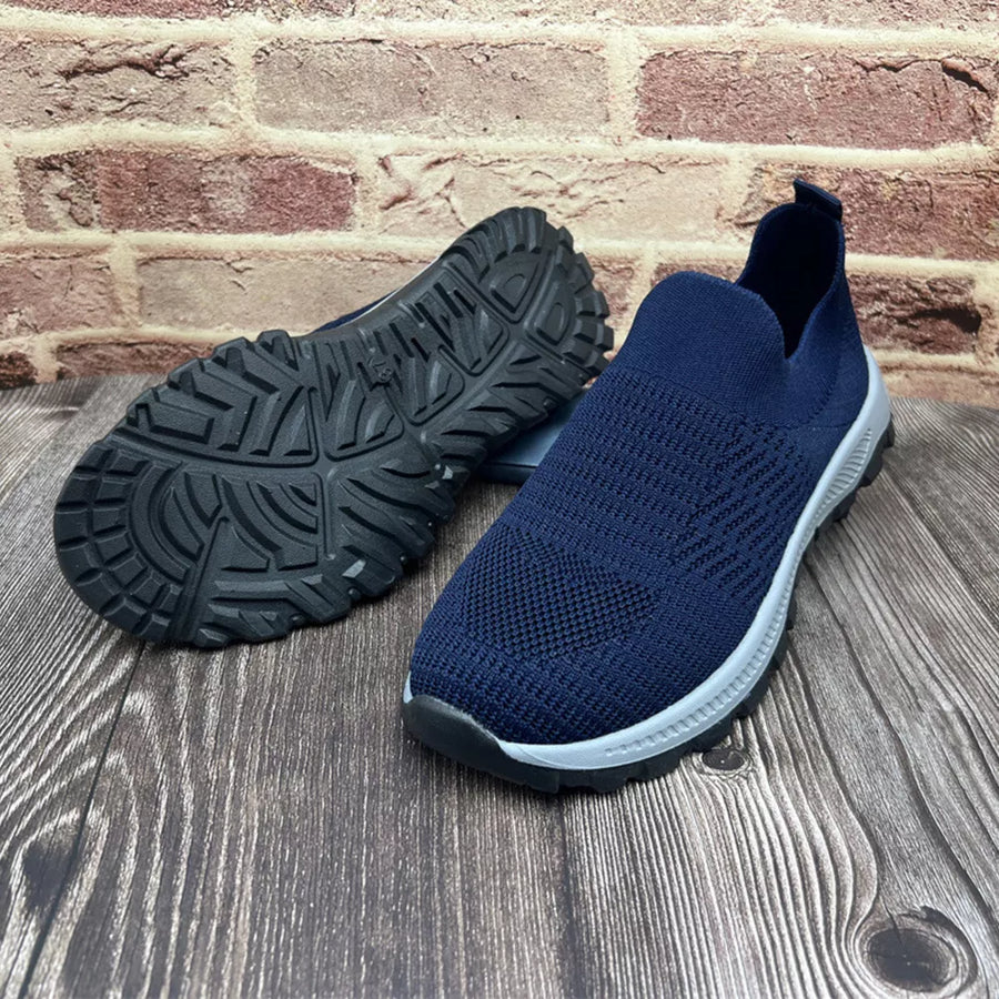 Blue breathable knit slip-on sneakers with round toe and textured sole.