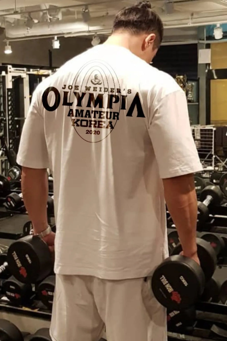 White oversized graphic tee with Olympia Amateur Korea 2020 print