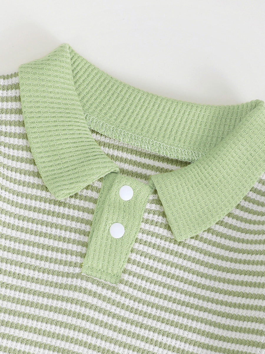 Green and white striped polo shirt with waffle knit texture and two white buttons.
