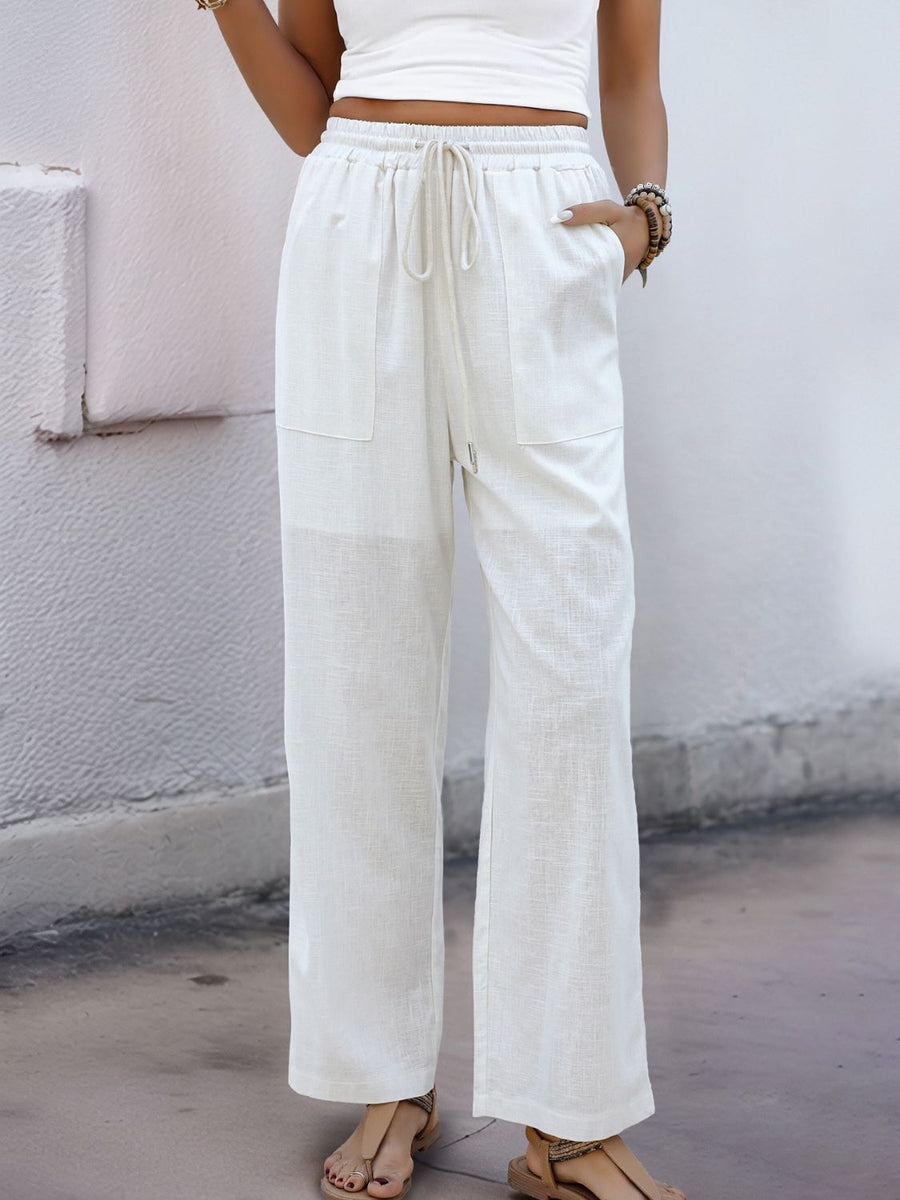 White linen-blend wide-leg trousers with drawstring waist and patch pockets