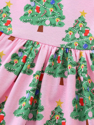 Pink cotton baby dress with a Christmas tree print and gathered waist