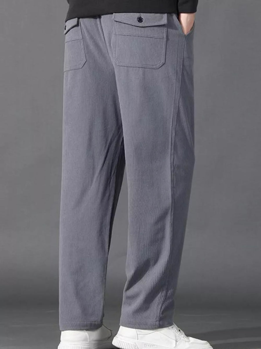 Light gray corduroy joggers with back flap pockets and drawstring waist.
