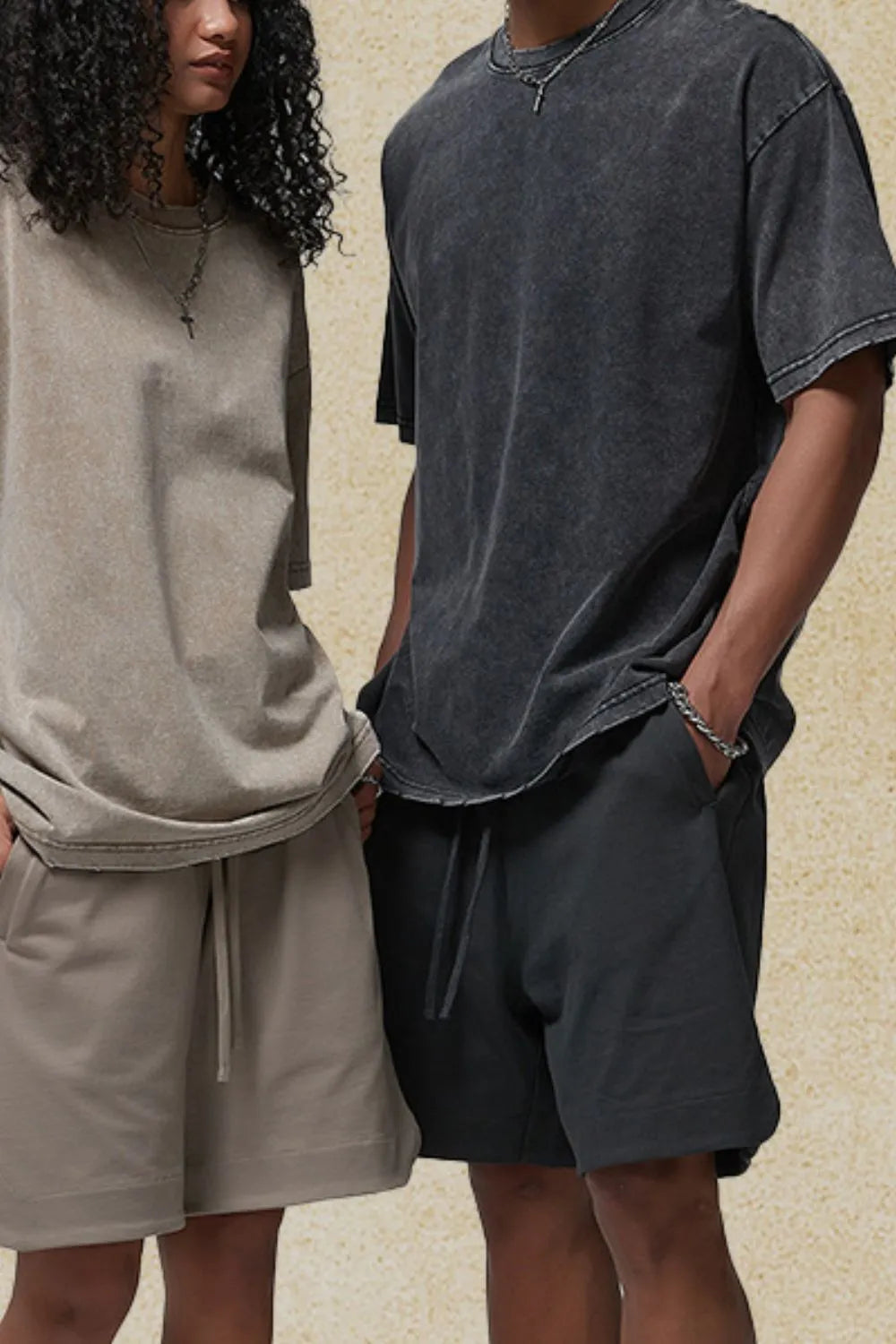 Essential half-sleeve round neck tee in dark gray with a washed effect, styled casually.