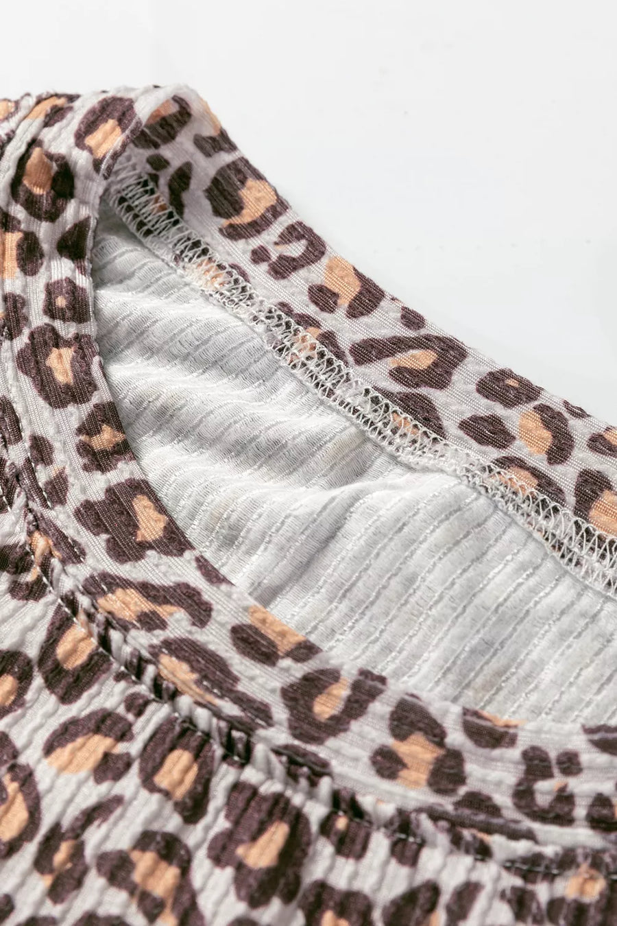 Leopard print ribbed loungewear set with crew neck detail.