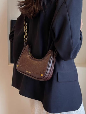 Coffee color crescent shoulder bag with chunky gold chain detail