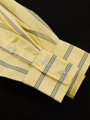 Yellow striped button-up shirt with white buttons and folded cuffs.