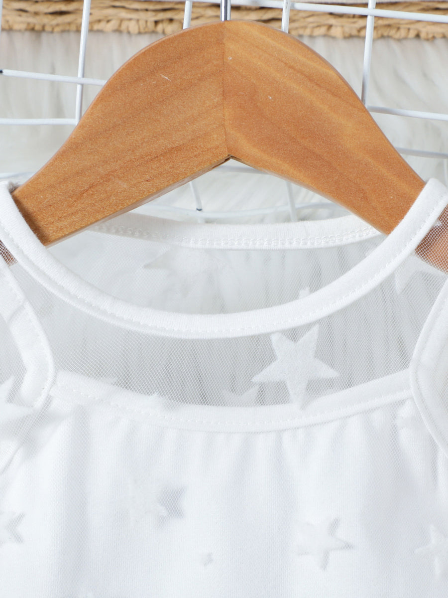 White cotton cami with sheer mesh overlay and embossed stars, round neckline.