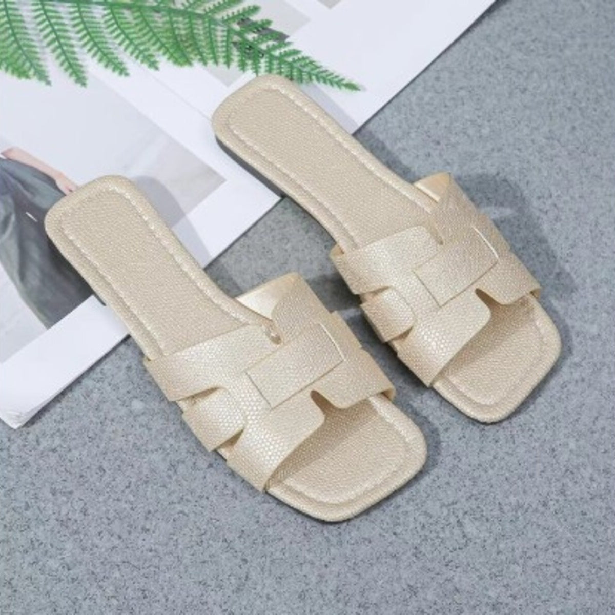 Beige textured slide sandals with H-strap detail