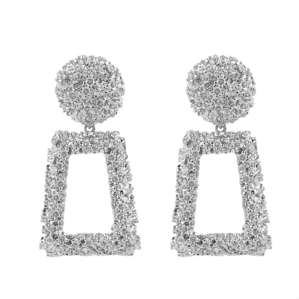 Silver geometric dangle earrings with textured detail