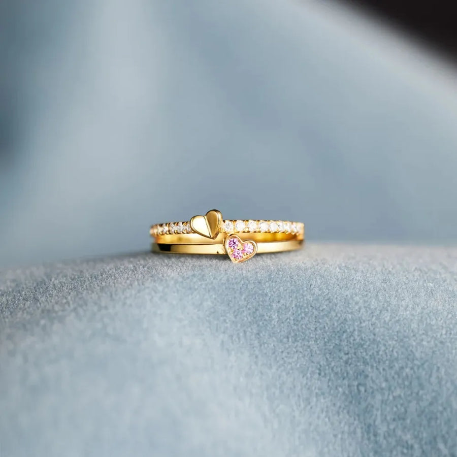 Gold layered rings with heart details and small stones