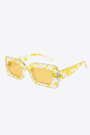 Rectangular frame sunglasses with swirl print in Butter Yellow and clear frames.