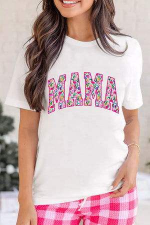 White graphic t-shirt with floral "MAMA" text, crew neck, short sleeves.