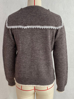 White cardigan with button-front and cable knit