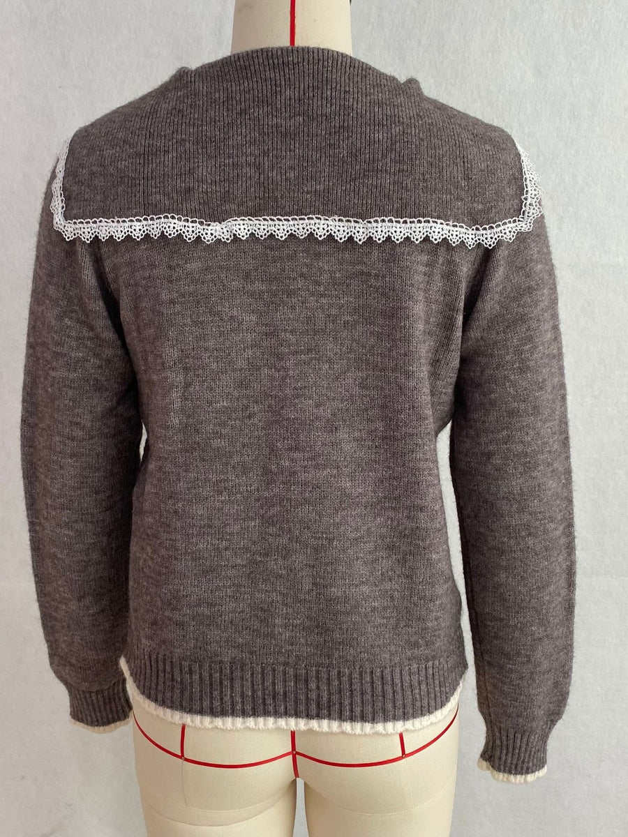 White cardigan with button-front and cable knit