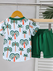 Baby tee and shorts set with tropical palm tree print and green trim, dark green shorts.