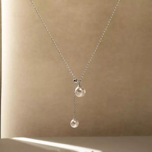 Synthetic Pearl,925 sterling silver Care instructions: Avoid wearing during exer necklace in cream with Y-shape silhouette