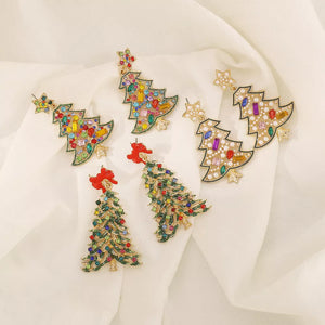 Festive rhinestone tree dangle earrings with colorful gems and red bows or white stars.