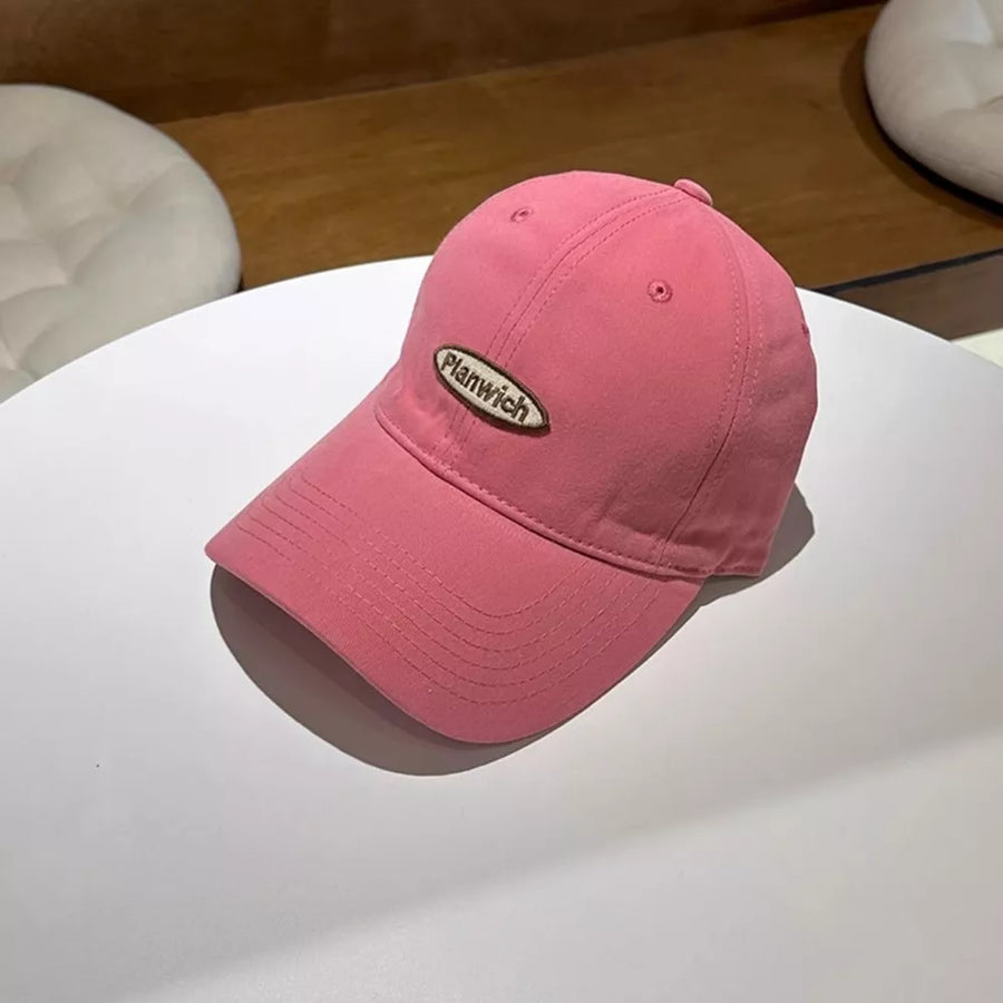Pink cotton baseball cap with oval embroidered logo detail