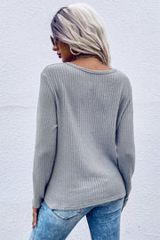 Gray waffle knit long sleeve top with knot detail, crew neck, casual fit.