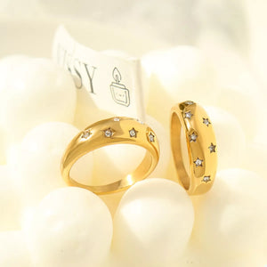 Gold rings with scattered zircon star details