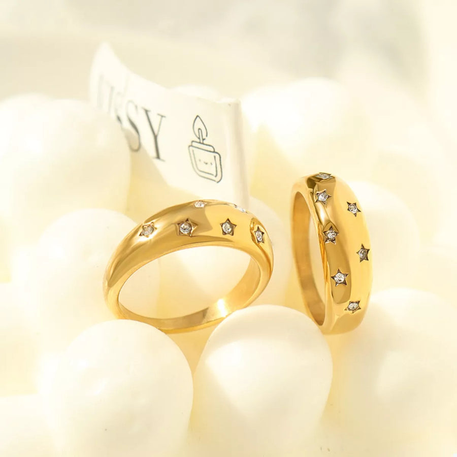 Gold rings with scattered zircon star details