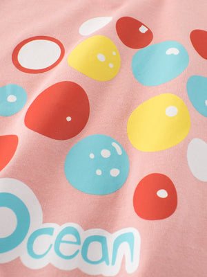 Pink t-shirt with colorful bubble print and "Ocean" text graphic