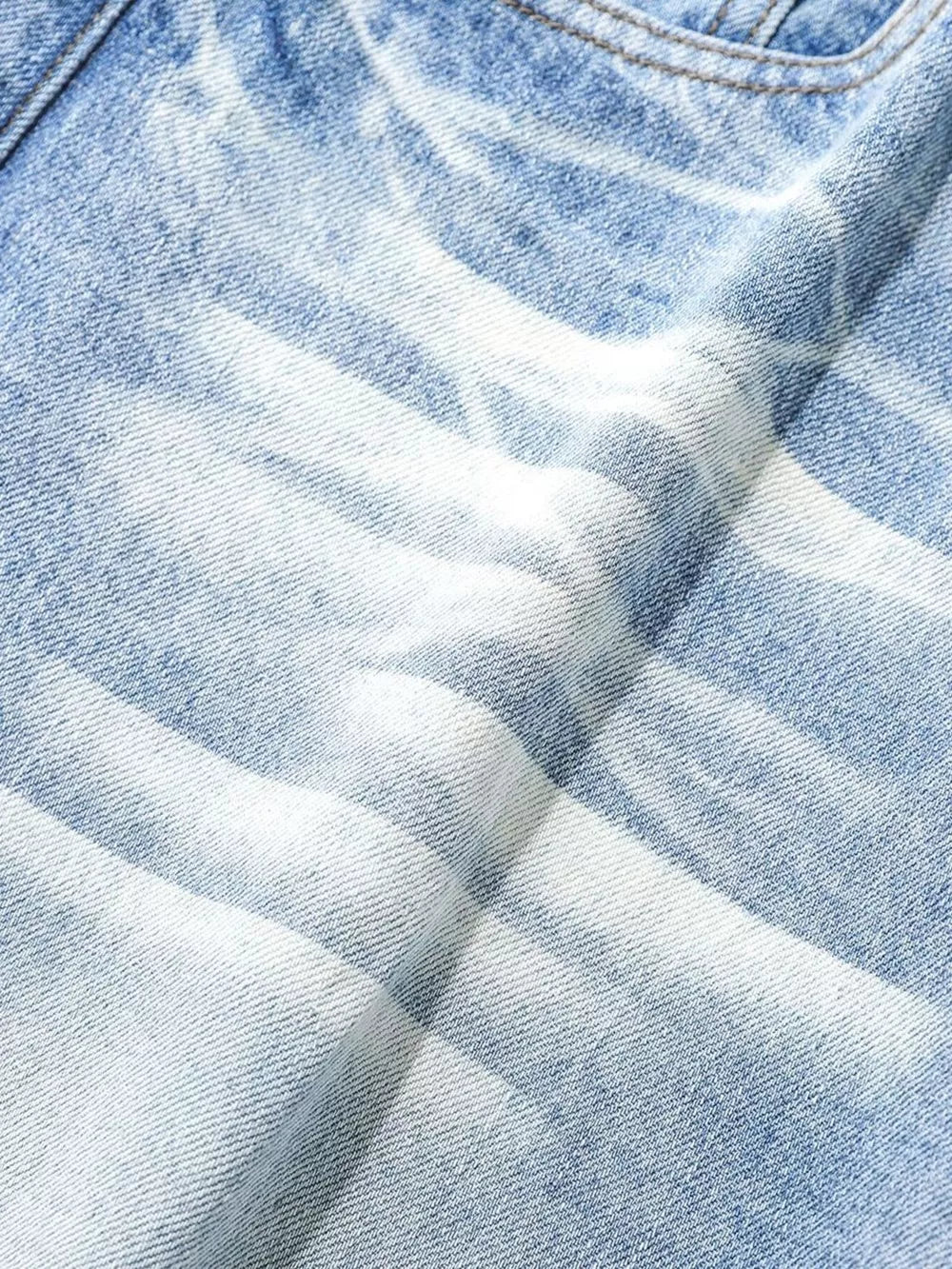 Light blue relaxed fit denim capris with a distressed wash and cotton fabric.
