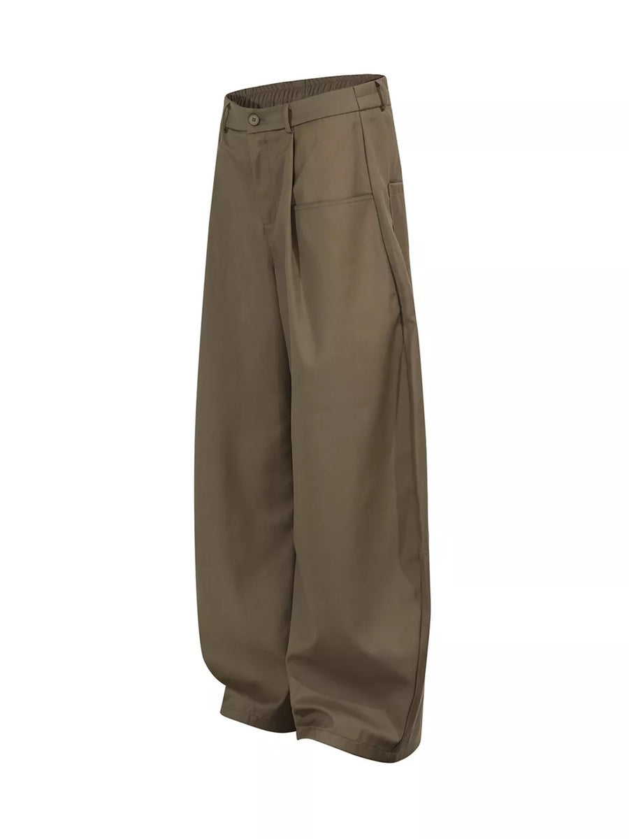 Brown pleated front wide-leg trousers with adjustable waist and button closure.