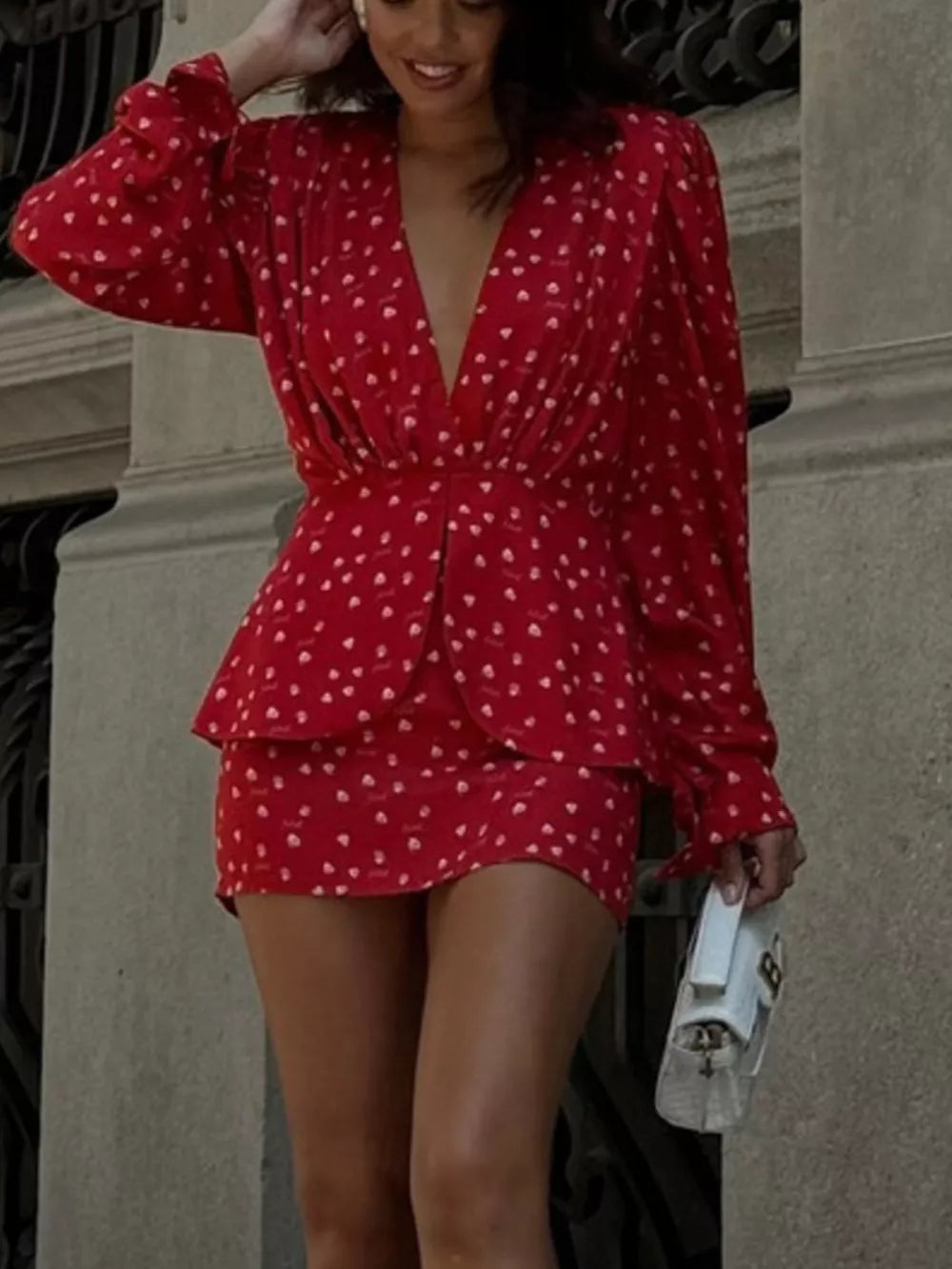 Red heart print mini dress with plunging V-neck and long sleeves