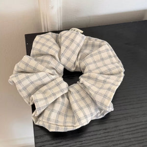 scrunchie featuring plaid in light blue with poluester Imported Size &amp texture