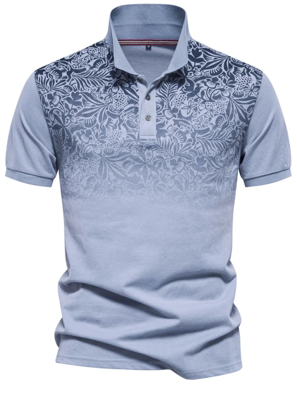 Light blue floral ombre polo shirt with short sleeves and a buttoned collar.