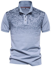 Light blue floral ombre polo shirt with short sleeves and a buttoned collar.