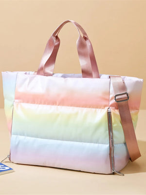 Prismatic padded tote bag with side zip and pink straps, featuring a rainbow ombre gradient.