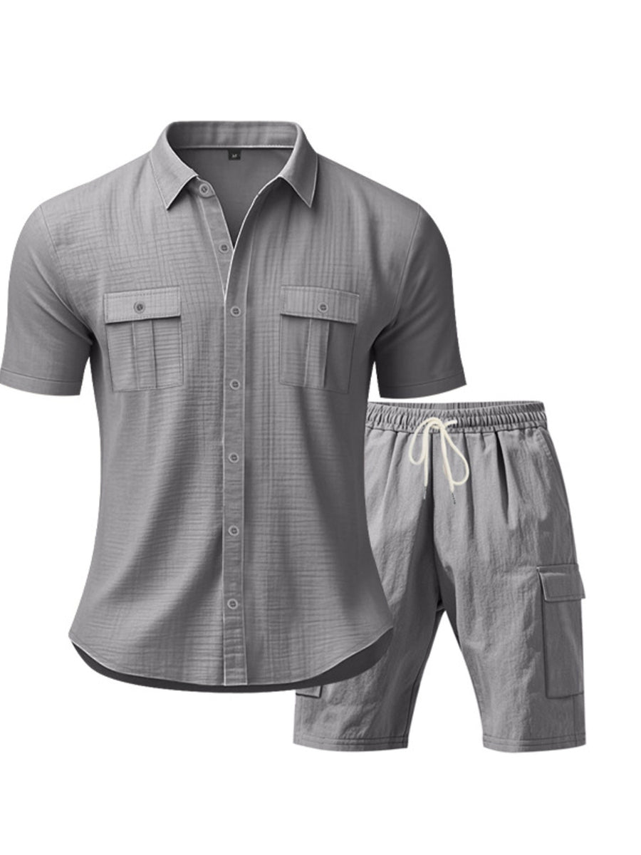 Grey relaxed-fit button-up shirt with two chest pockets and drawstring shorts.