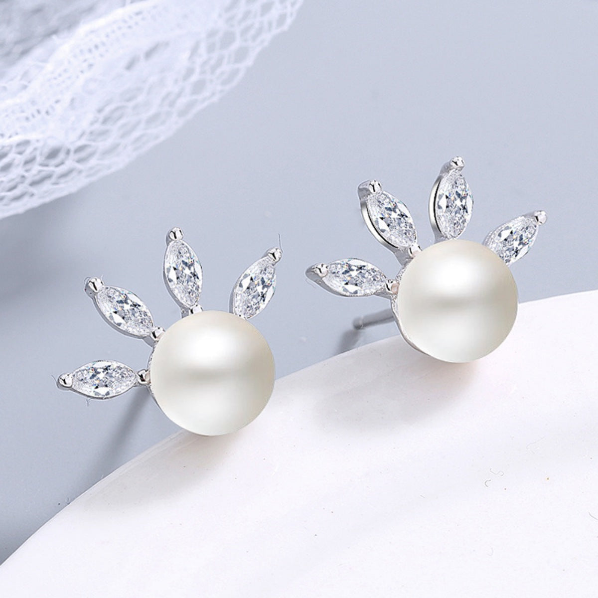 earrings in ivory featuring pearl accent and stud fit