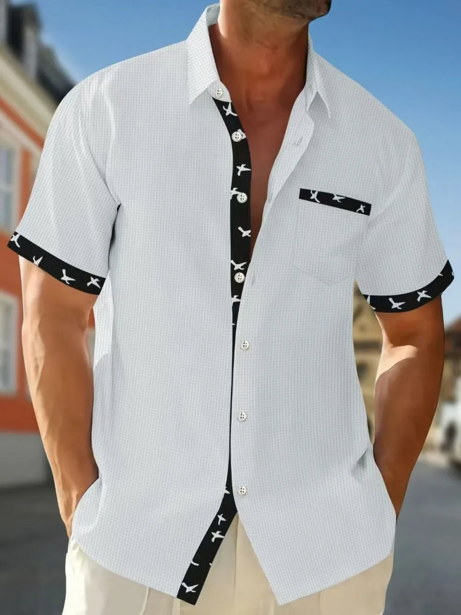 White waffle weave short sleeve shirt with airplane print contrast trim and pocket.