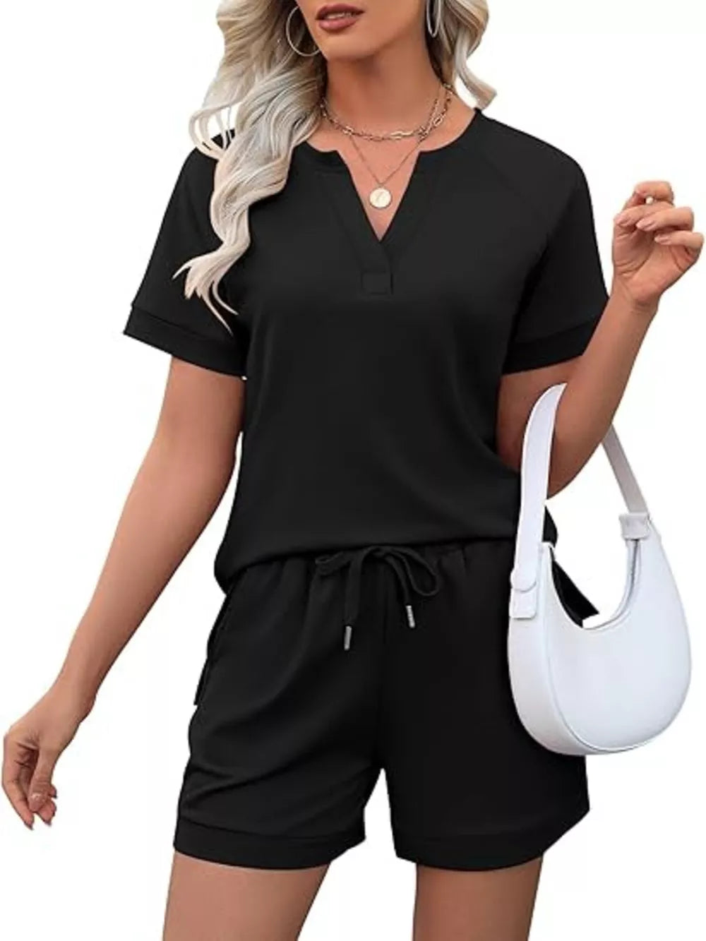 Black relaxed two-piece set with v-neck top and drawstring shorts with pockets
