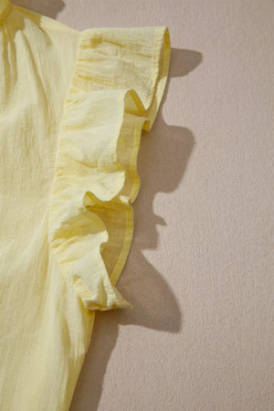 Yellow cotton blend shirt with ruffled cap sleeves and V-neck detail.