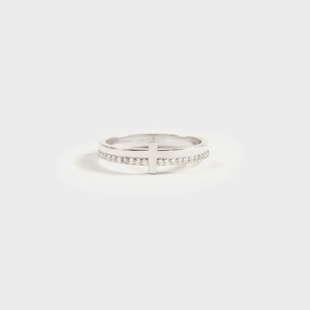 Silver pavé cross band ring with a subtle cross detail.