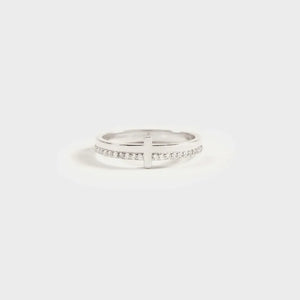 Silver pavé cross band ring with a subtle cross detail.